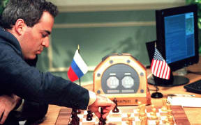Gary Kasparov losing to IBM's Deep Blue computer in 1997